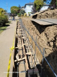 Retaining wall under construction at HT Paving and Sealcoating.