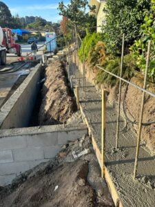 Concrete pouring for a retaining wall at HT Paving and Sealcoating.