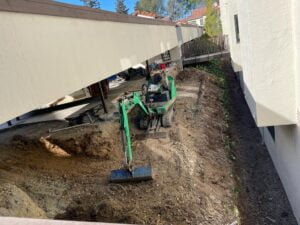 In-progress retaining wall construction under HT Paving and Sealcoating's expertise.