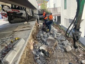 HT Paving and Sealcoating's skilled team constructing a retaining wall. Gallery